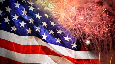 American flag with red, white, and blue fireworks. Independence Day Fourth of July image.