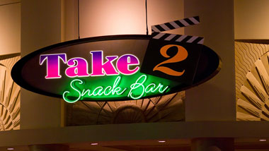 The Take 2 Snack Bar neon sign.