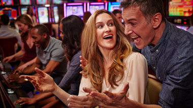 couple playing a slot machine