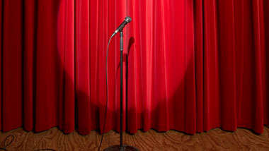 red curtain stage and microphone
